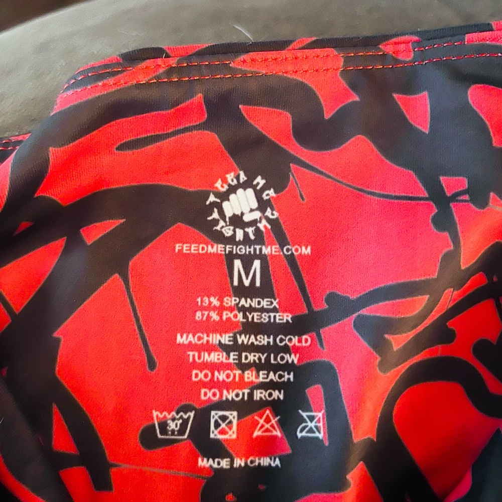 Feed Me Fight Me red and black leggings